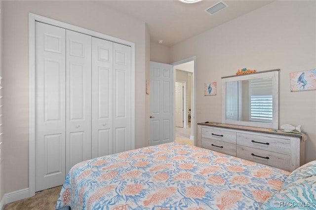 carpeted bedroom featuring a closet