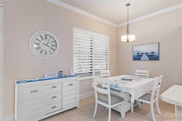 dining room with ornamental molding and light tile patterned floors