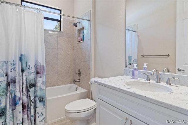 full bathroom with vanity, shower / tub combo, and toilet