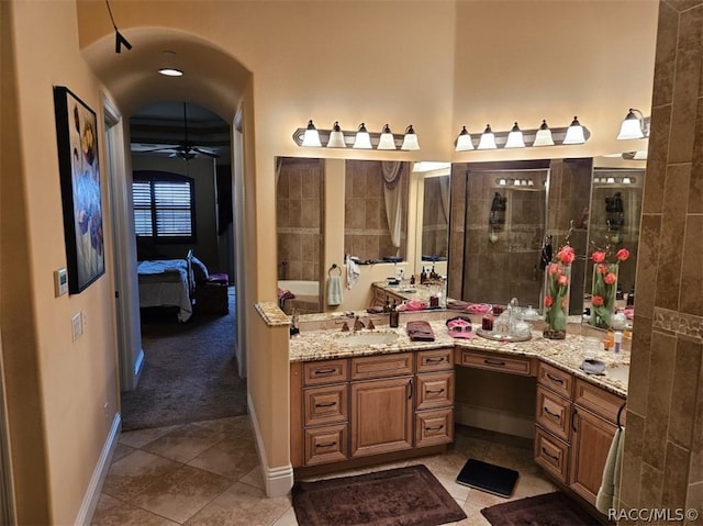 1103 W Pointe Vista Path Unit A4, Hernando, FL 34442 - bathroom with connected bathroom, vanity, tile patterned floors, and a ceiling fan