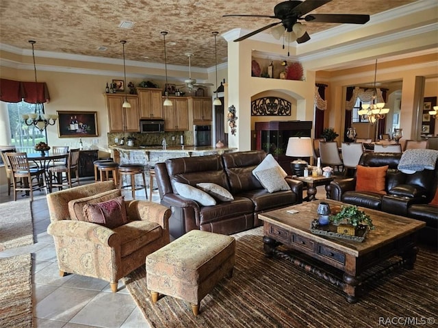 1103 W Pointe Vista Path Unit A4, Hernando, FL 34442 - living area with a chandelier, ornamental molding, ceiling fan, and light tile patterned floors