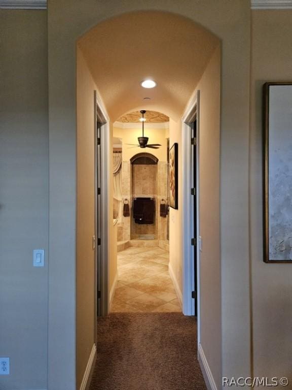 1103 W Pointe Vista Path Unit A4, Hernando, FL 34442 - hall with carpet flooring, arched walkways, recessed lighting, and tile patterned flooring