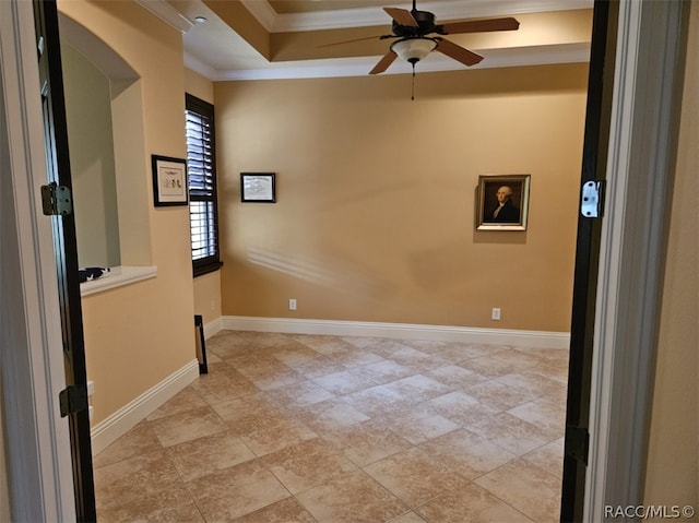 empty room with ceiling fan and ornamental molding