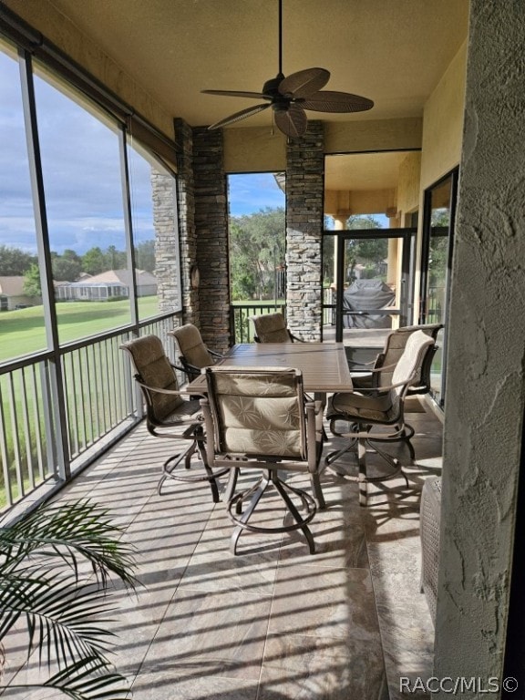 sunroom / solarium with ceiling fan