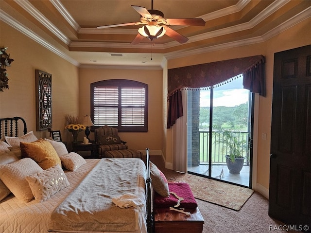 carpeted bedroom featuring crown molding, access to outside, and a tray ceiling