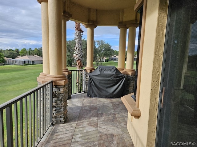 balcony featuring a porch and area for grilling