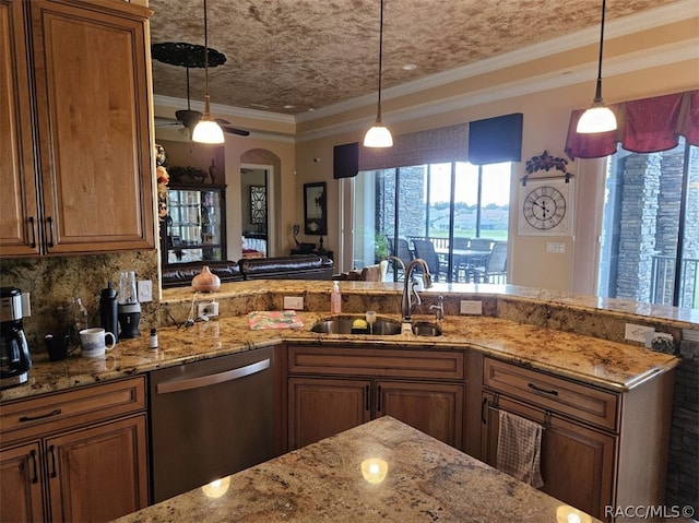 kitchen featuring ornamental molding, dishwasher, pendant lighting, and sink