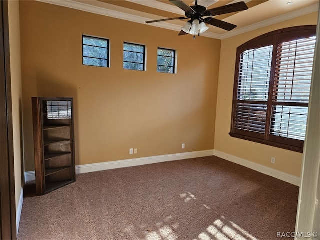 carpeted spare room with crown molding and ceiling fan