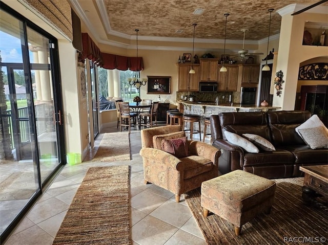 1103 W Pointe Vista Path Unit A4, Hernando, FL 34442 - living room with crown molding, light tile patterned floors, and a ceiling fan