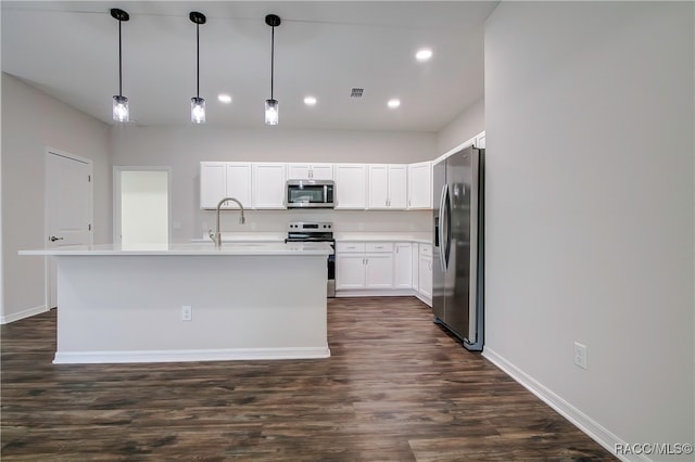 kitchen featuring white cabinets, decorative light fixtures, dark hardwood / wood-style floors, and stainless steel appliances