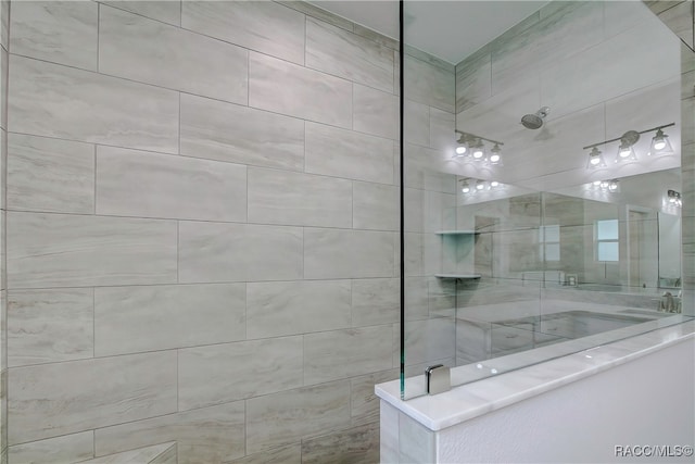 bathroom with tiled shower