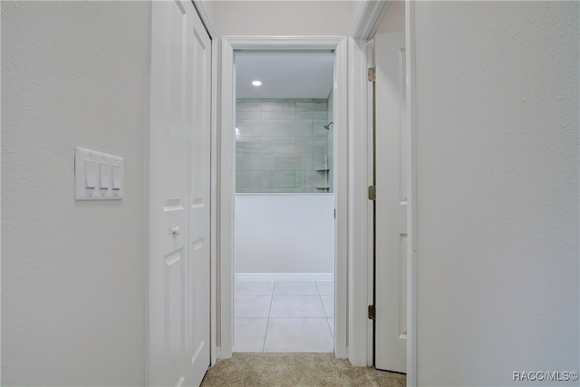 hallway with light tile patterned floors