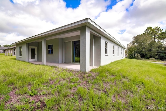 rear view of house with a patio