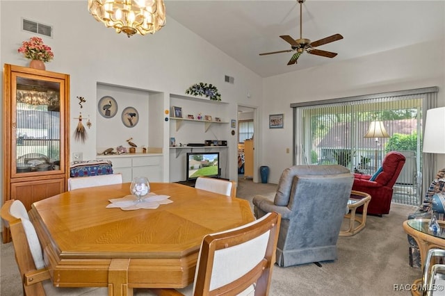 3621 N Lucille Dr, Beverly Hills, FL 34465 - dining area featuring light carpet, ceiling fan, high vaulted ceiling, and a chandelier