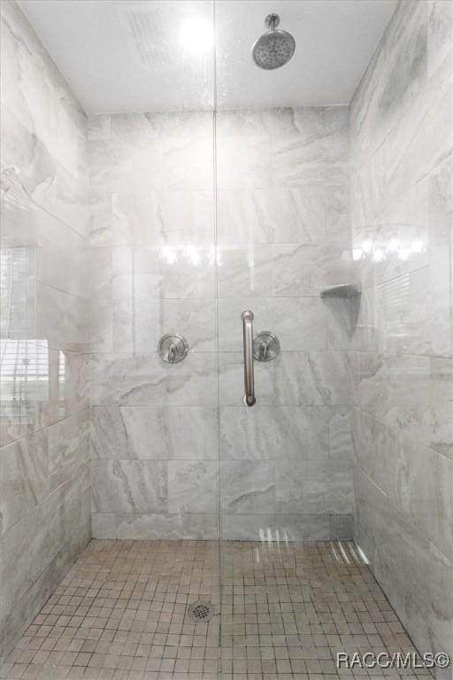full bath featuring a stall shower