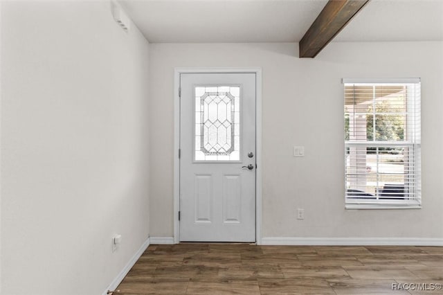 entrance foyer with beam ceiling, wood finished floors, and baseboards