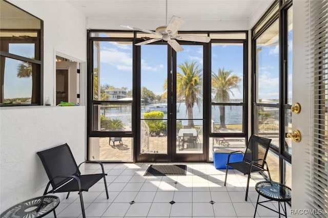 sunroom featuring ceiling fan