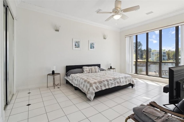 bedroom with baseboards, light tile patterned flooring, a ceiling fan, and ornamental molding