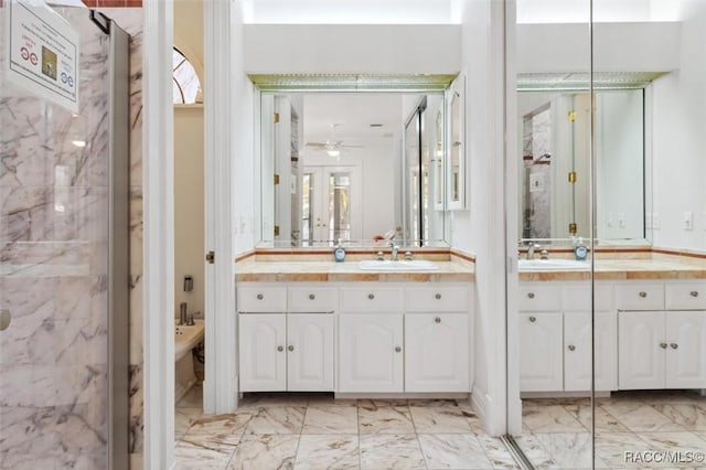 bathroom featuring a bidet, a ceiling fan, marble finish floor, and vanity