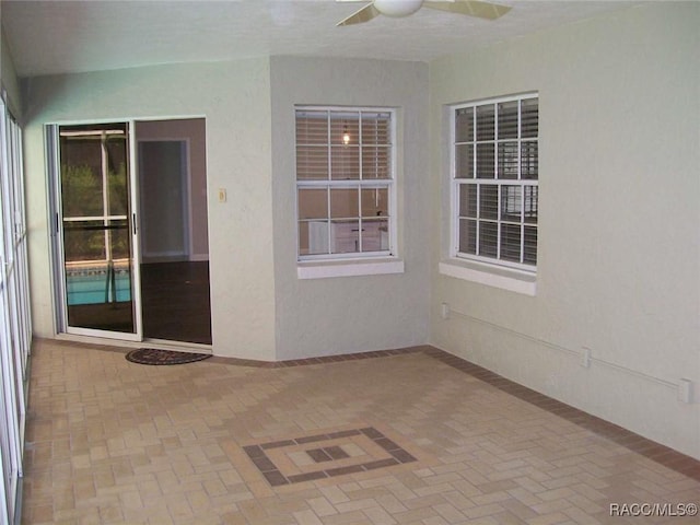 view of patio / terrace featuring ceiling fan