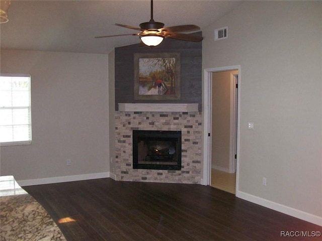 unfurnished living room featuring dark wood-type flooring, ceiling fan, and vaulted ceiling