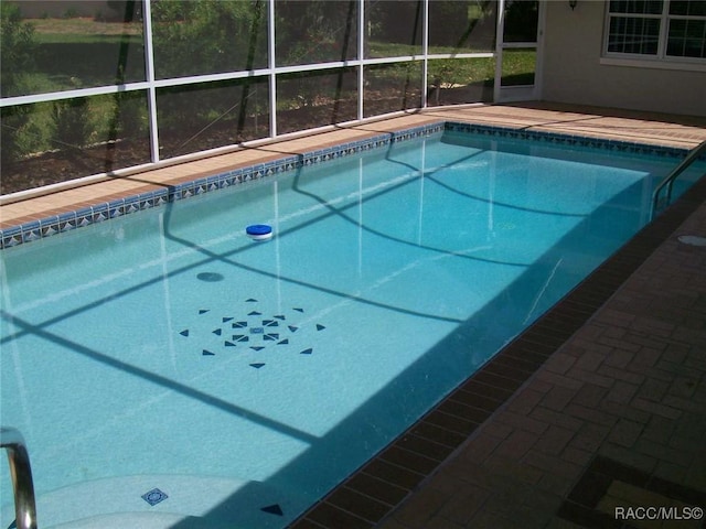 view of pool featuring a lanai