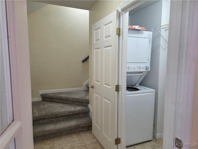 933 N Rembrandt Way, Inverness, FL 34453 - washroom with stacked washer / dryer and light tile patterned floors