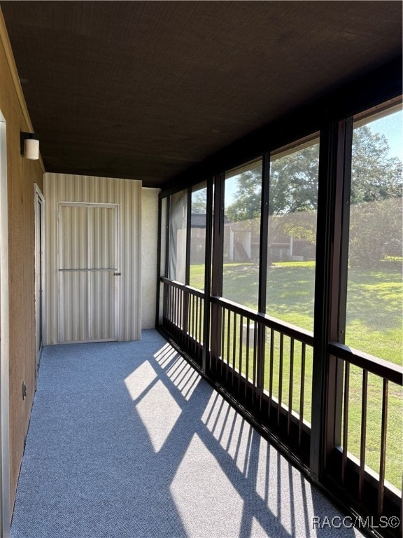 unfurnished sunroom featuring a healthy amount of sunlight