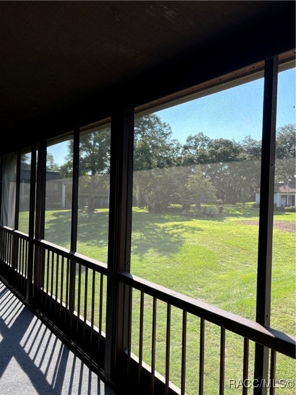 unfurnished sunroom with plenty of natural light