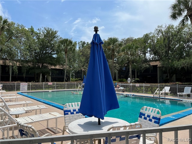 view of swimming pool featuring a patio area