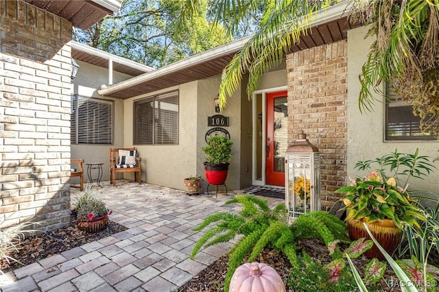 property entrance featuring a patio area