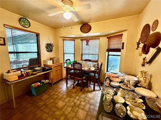 2750 W Mustang Blvd, Beverly Hills, FL 34465 - dining room featuring a ceiling fan and brick patterned floors