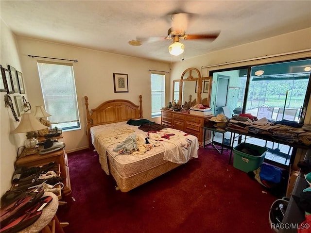 2750 W Mustang Blvd, Beverly Hills, FL 34465 - bedroom featuring access to outside, dark carpet, and ceiling fan