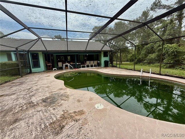2750 W Mustang Blvd, Beverly Hills, FL 34465 - outdoor pool with a patio and glass enclosure