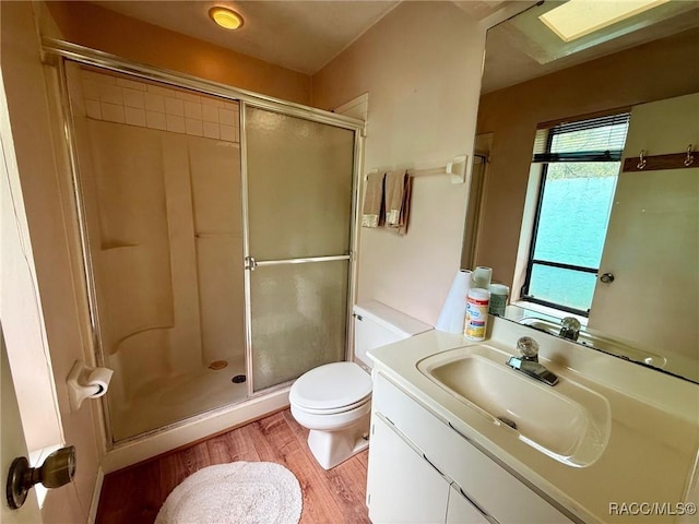 2750 W Mustang Blvd, Beverly Hills, FL 34465 - bathroom featuring wood finished floors, a shower stall, and vanity