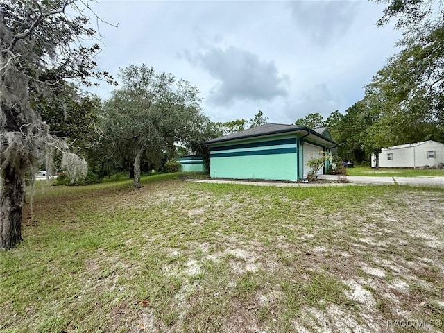 2750 W Mustang Blvd, Beverly Hills, FL 34465 - view of yard featuring an attached garage