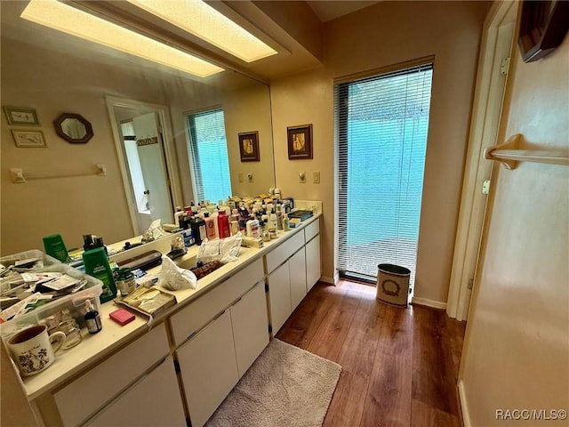 2750 W Mustang Blvd, Beverly Hills, FL 34465 - bathroom with wood finished floors, vanity, and plenty of natural light