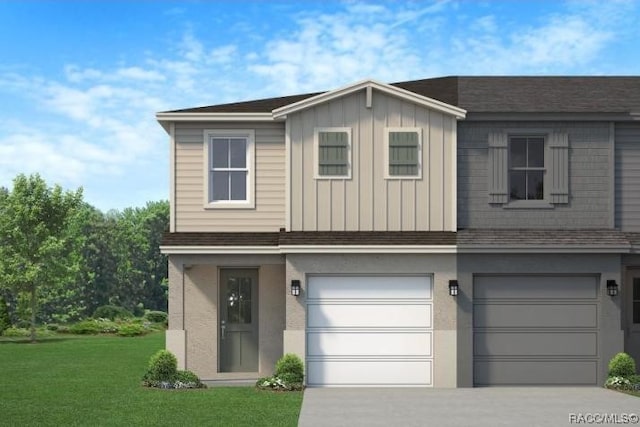 view of front of property with a garage and a front yard