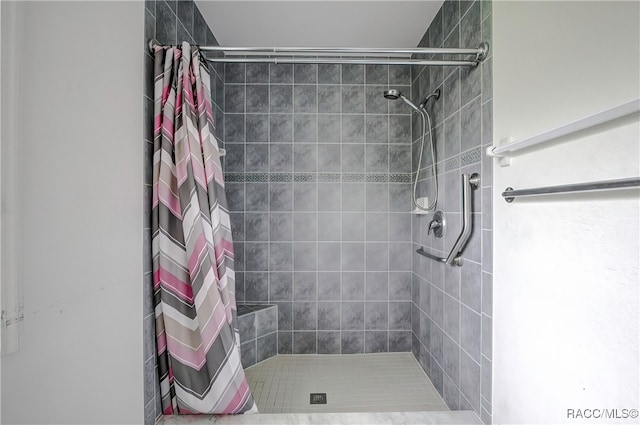 bathroom with a shower with curtain