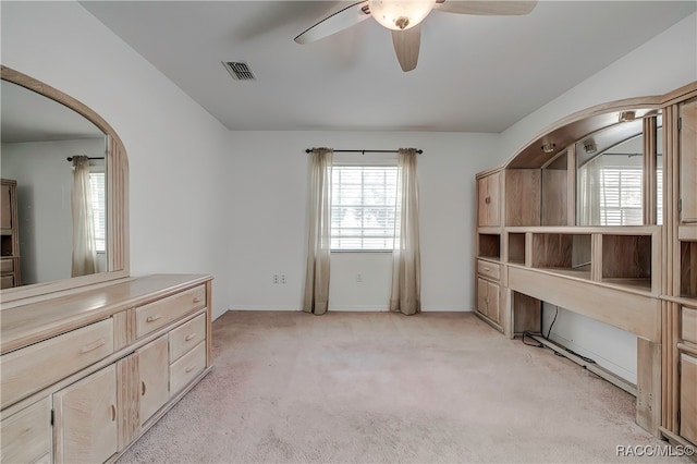 interior space with ceiling fan