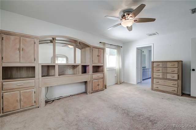 interior space with light colored carpet and ceiling fan