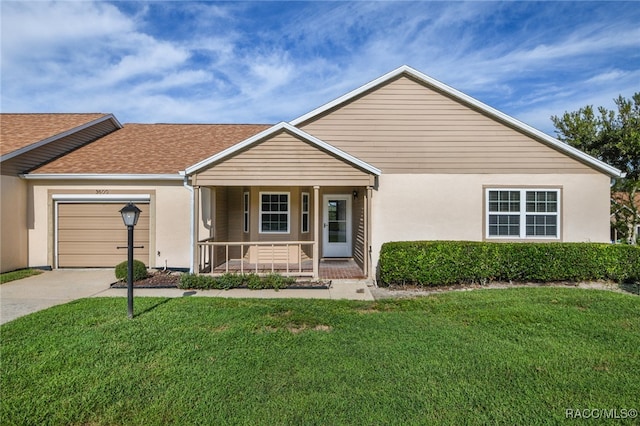 single story home with a front yard, a porch, and a garage