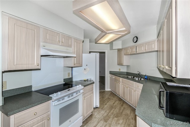 kitchen featuring electric range, sink, light hardwood / wood-style floors, and light brown cabinets