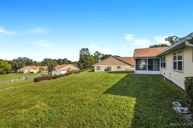 view of yard with a sunroom