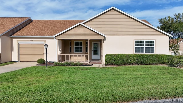 single story home featuring a front lawn, a porch, and a garage