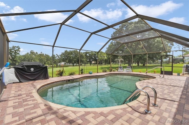 391 E Falconry Ct, Hernando, FL 34442 - outdoor pool featuring a grill, a lawn, a patio, and a lanai