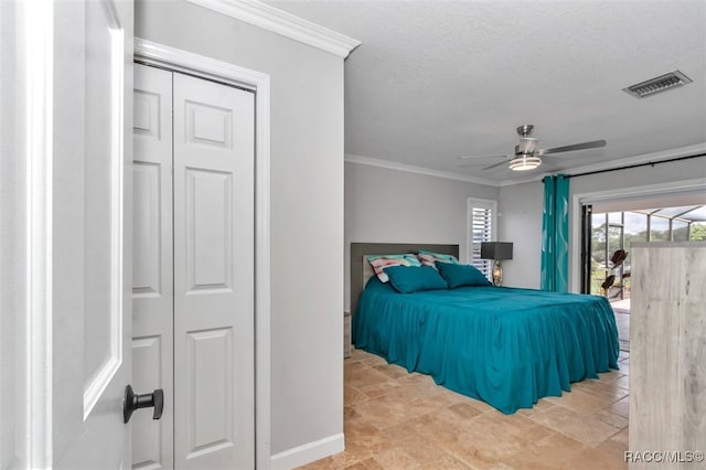 391 E Falconry Ct, Hernando, FL 34442 - bedroom with access to outside, crown molding, ceiling fan, a textured ceiling, and stone finish flooring