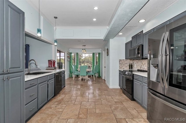 391 E Falconry Ct, Hernando, FL 34442 - kitchen with stainless steel appliances, gray cabinets, tasteful backsplash, stone tile flooring, and light countertops