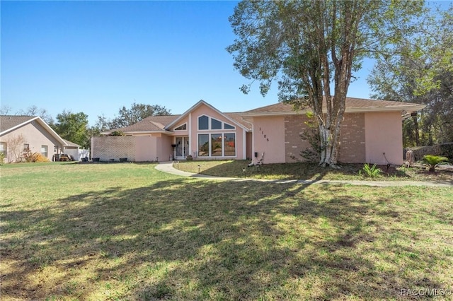 view of front of home with a front lawn