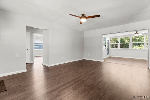 spare room featuring dark hardwood / wood-style floors and ceiling fan